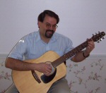 Douglas Twitchell playing the guitar